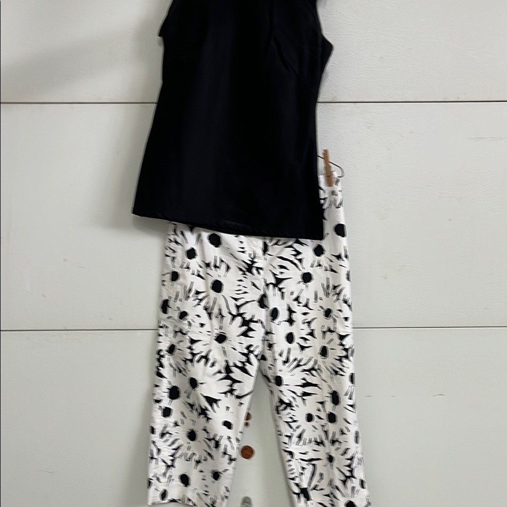 Black and White Floral Women's capri pants with black top.